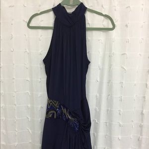 Blue open back sleeveless dress.